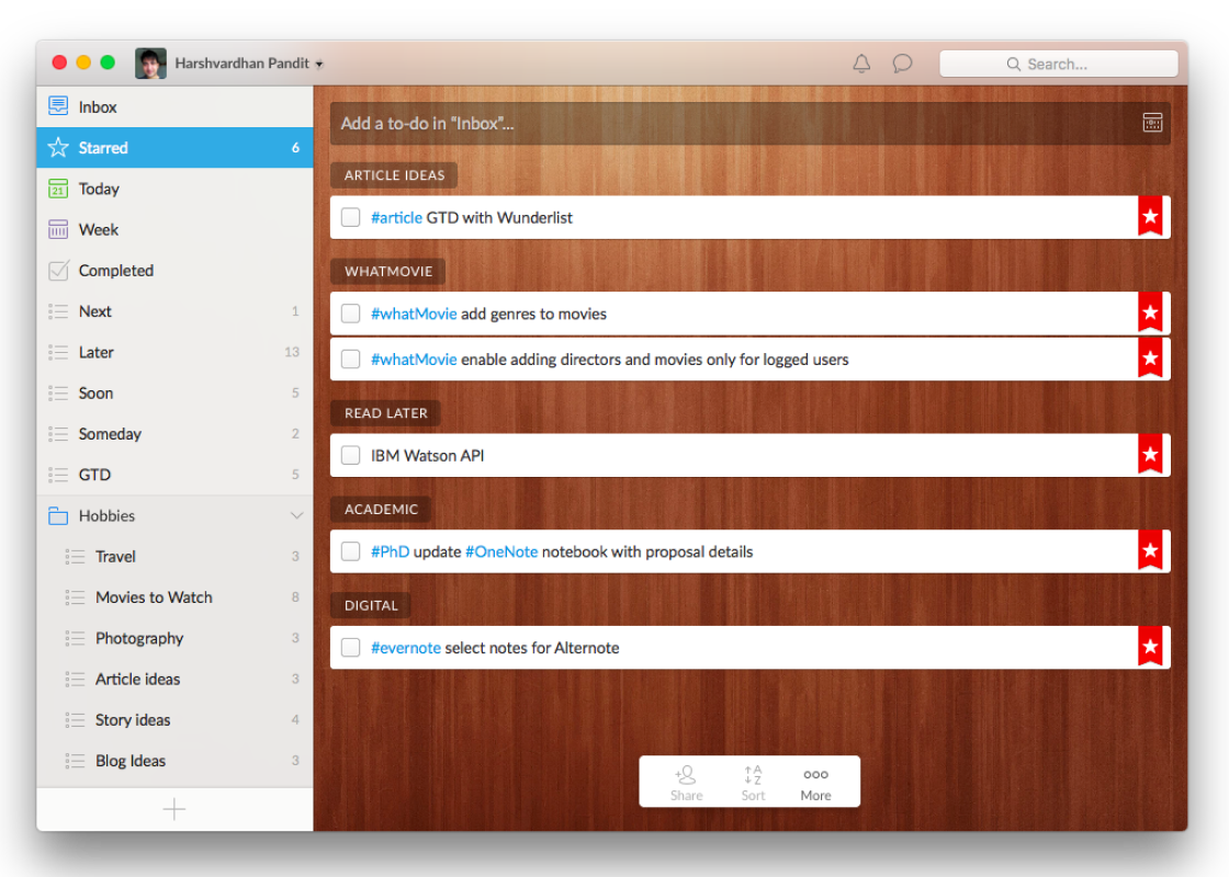 The Wunderlist window, showing starred tasks as spaced white cards on its wooden background